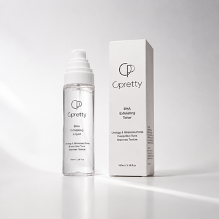 Cpretty BHA Exfoliating Liquid toner shown in a clear bottle with a white pump next to its white product box on a clean white background.
