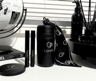 Opretty luxury clip-on lipstick bag styled with beauty products in everyday vanity setting