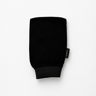 black exfoliating mitt on white background 