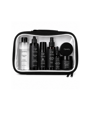 A clear zippered cosmetic bag with black trim containing a set of black skincare bottles and jars from Opretty, shown on a white background.