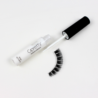 Cpretty white eye shadow applicator tube with a black cap and applicator wand, shown next to a black false eyelash strip on a white background.