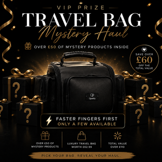 A black Carry brand travel bag is centered in a promotional graphic with gold ribbon bows, mystery gift boxes with question marks, and gold decorative confetti and streamers. Text reads 'VIP PRIZE TRAVEL BAG Mystery Haul' and includes offer copy about over £50 of mystery products inside and saving over £60.